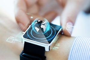 close-up-of-hand-with-globe-hologram-on-smartwatch